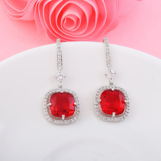 Red Color American Diamond Earrings In Twisted Loop Inspired Statement Design