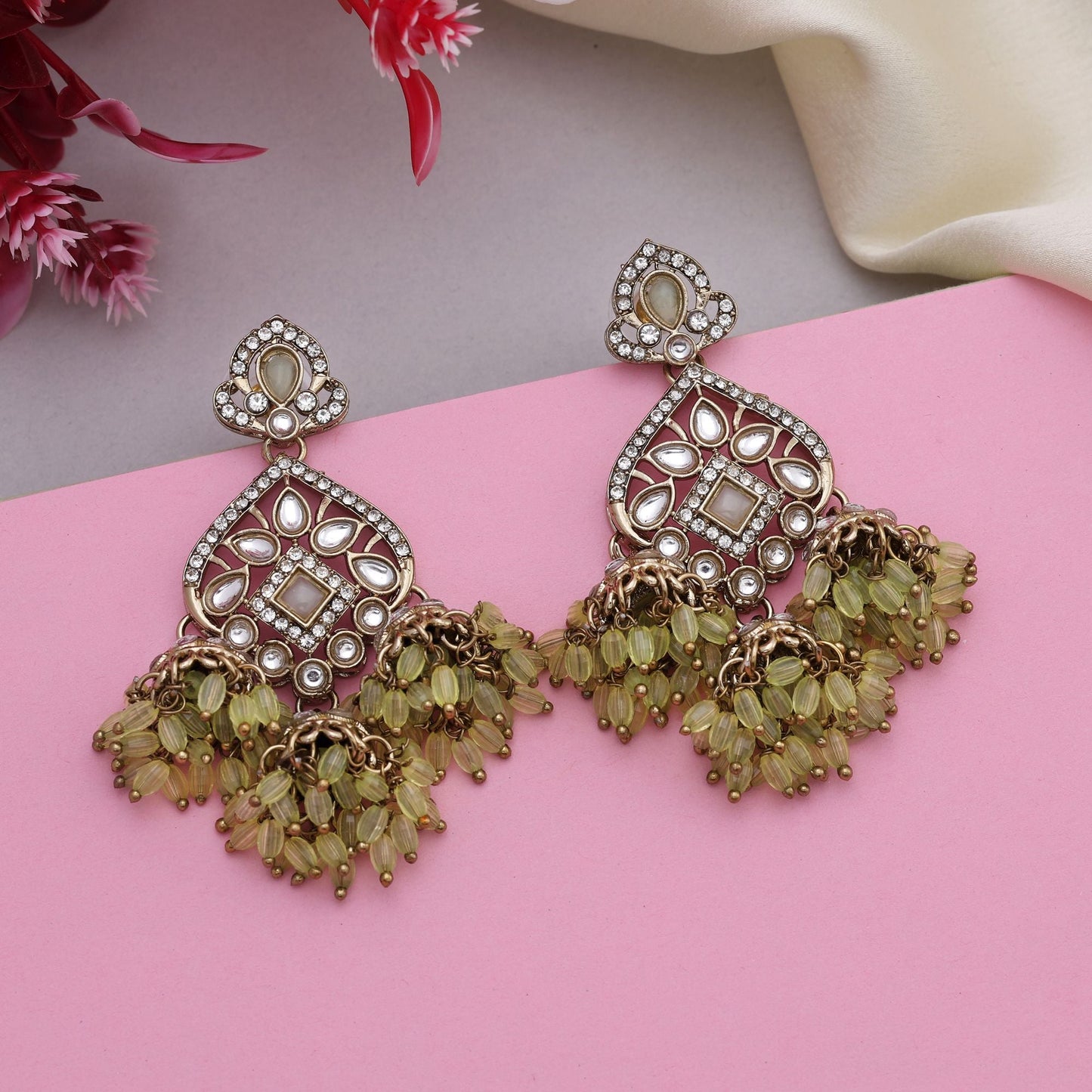 Elegant Pista Green Color Kundan Earrings With Gold Polish For Traditional Looks