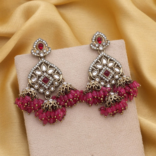 Beautiful Rani Color Kundan Earrings With Gold Finish Perfect For Indian Occasions