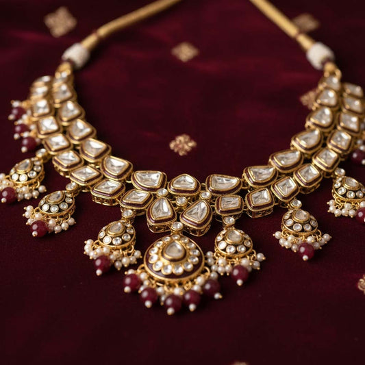 Glamorous Maroon Color Kundan Necklace Set With Gold Highlights