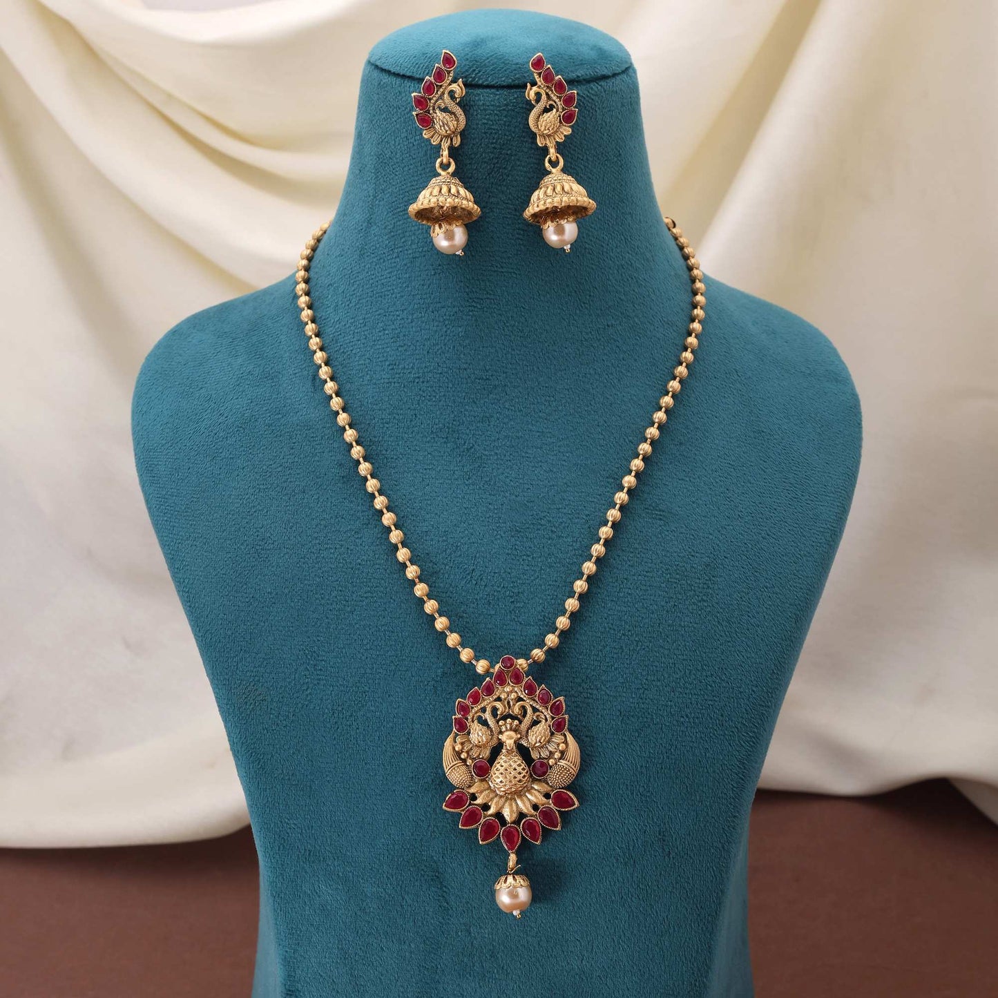 Beautiful Rani Color Matte Gold Necklace Set With Precious Stone Ornamentation