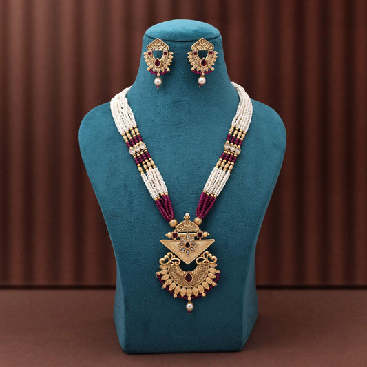 Gorgeous Rani Color Matte Gold Necklace Set With Premium Stone Embellished Temple Motifs