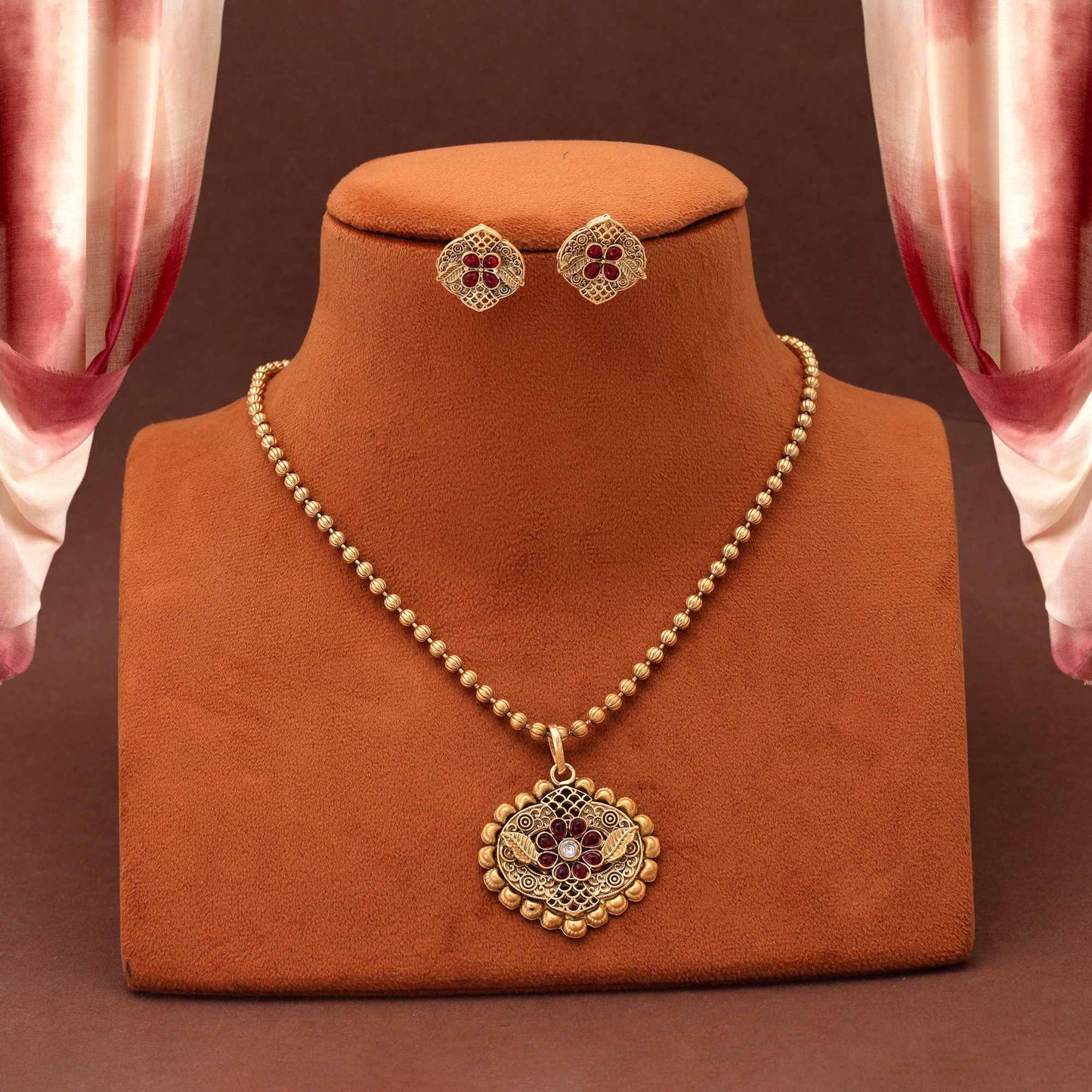 Beautiful Rani Color Matte Gold Necklace Set With Classic Floral Patterned Pendant Design