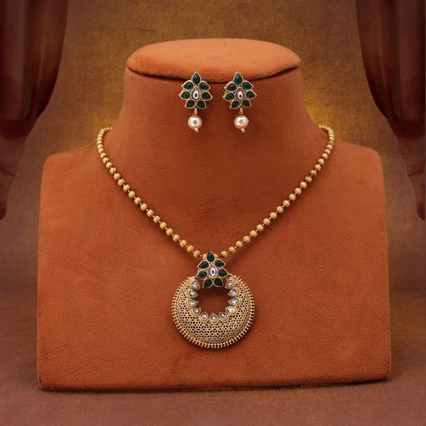 Gorgeous Green Color Matte Gold Necklace Set Crafted With Kundan Stones And Artistic Embellishments