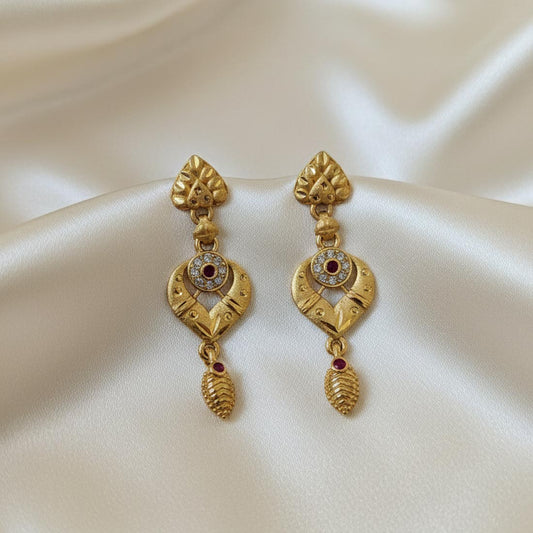 Gold Color Antique Earrings Highlighting Intricate Patterns And Heritage Craftsmanship