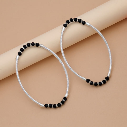Trendige schwarze, oxidierte Fußkette für Boho-Party-Styling