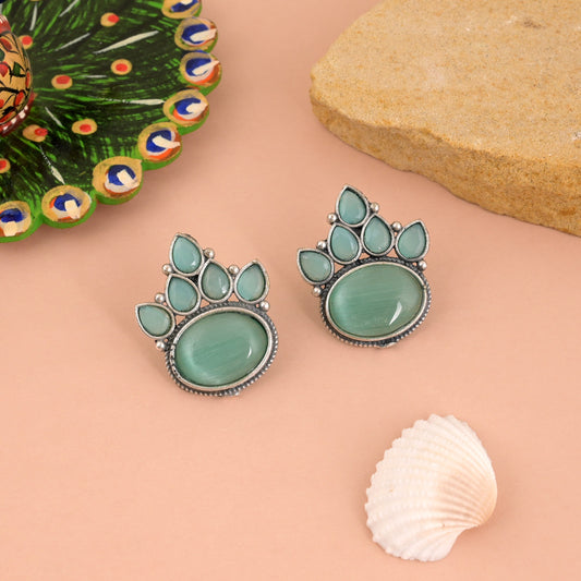 Charming Pista Green Color Oxidised Earrings With Floral Carving Design