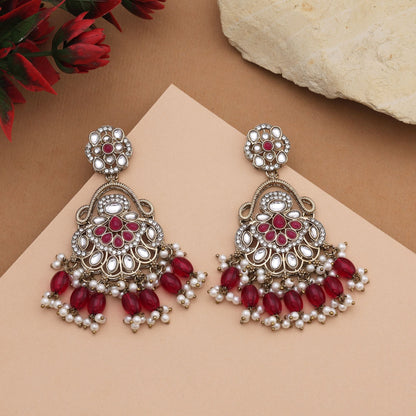 Gorgeous Rani Color Kundan Earrings With Intricate Stones For Bridal Attire