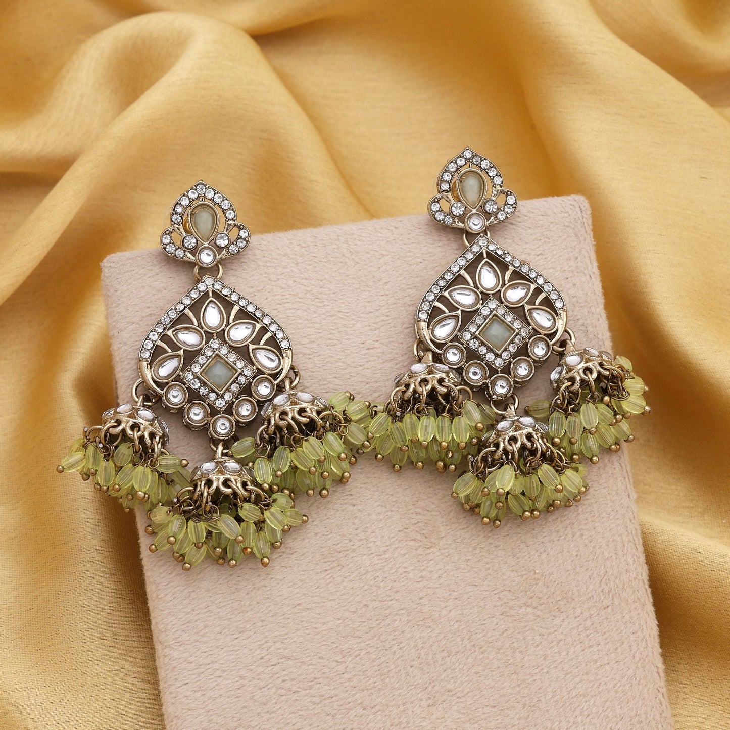 Elegant Pista Green Color Kundan Earrings With Gold Polish For Traditional Looks