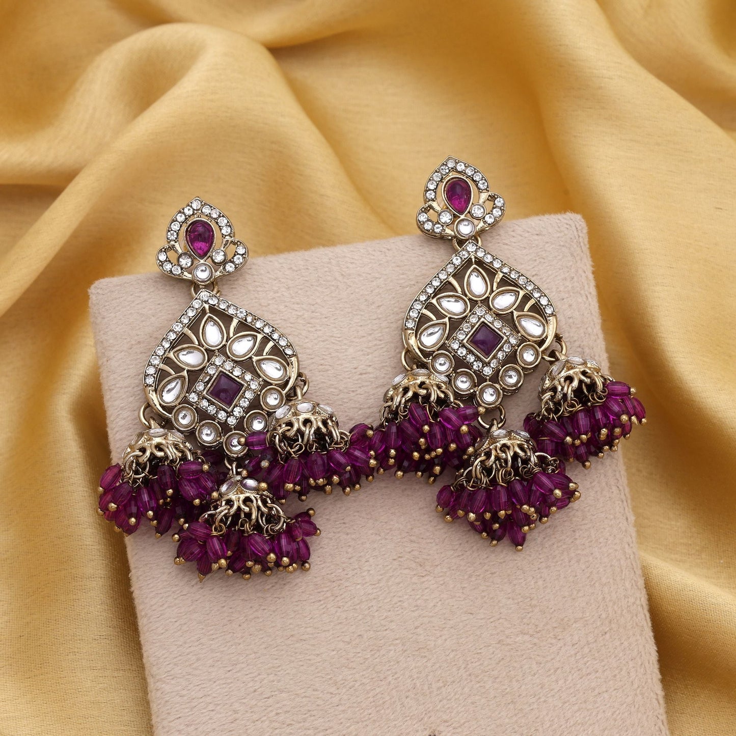 Graceful Purple Color Kundan Earrings With Stone Finish Perfect For Cultural Events