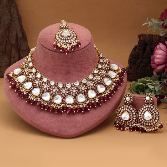 Gorgeous Maroon Color Meena Work Kundan Necklace Set Designed With Artistic Detailing For Brides