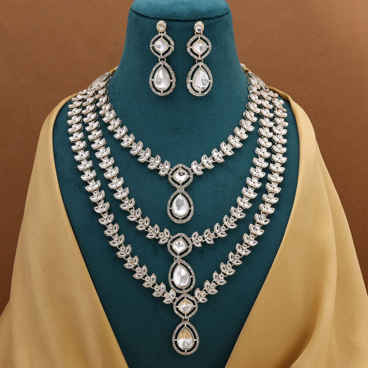 Gorgeous White Color Kundan Necklace Set With Delicate Stones And Ethnic Inspired Design | FEMNARI