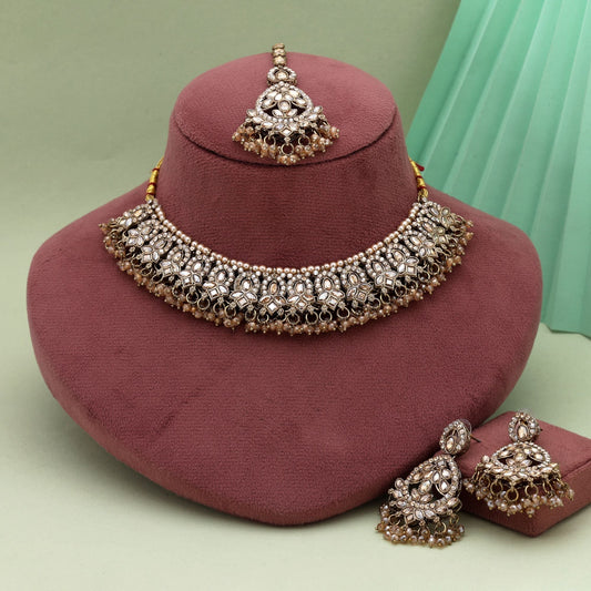 Designer Gold Color Kundan Necklace Set With Pearls And Sparkling Detailing
