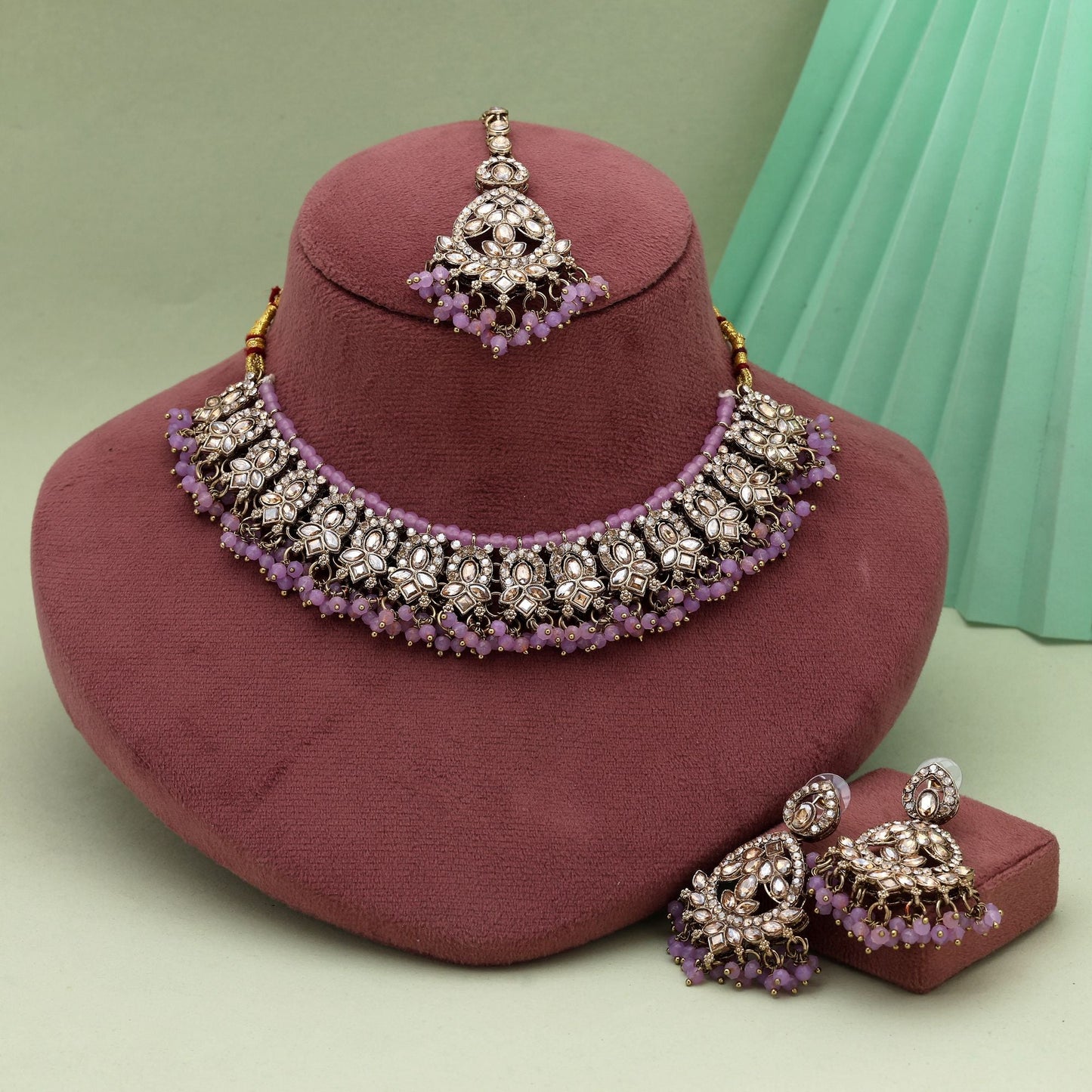 Beautiful Light Purple Color Kundan Necklace Set With Beads And Gold Finish