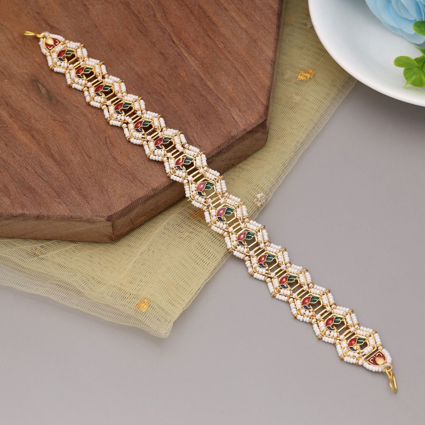 Maroon & Green Color Kundan Matha Patti Featuring Bold Colors And Royal Design