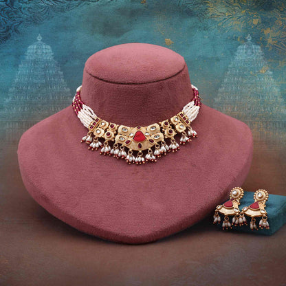 Captivating Rani Color Matte Gold Necklace Set With Beautiful Ornamental Detailing