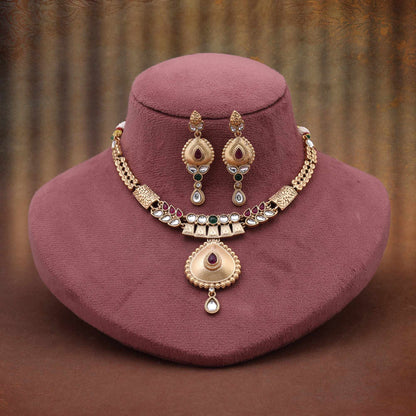 Ornate Rani And Green Color Matte Gold Necklace Set With Royal Embellishments
