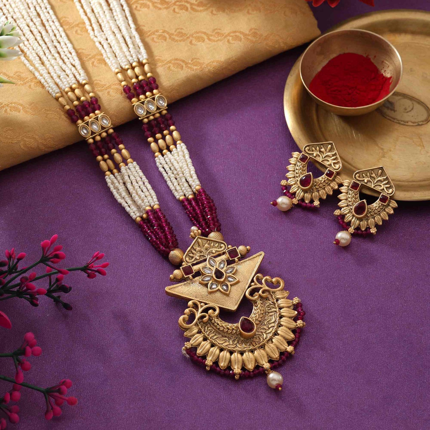 Gorgeous Rani Color Matte Gold Necklace Set With Premium Stone Embellished Temple Motifs
