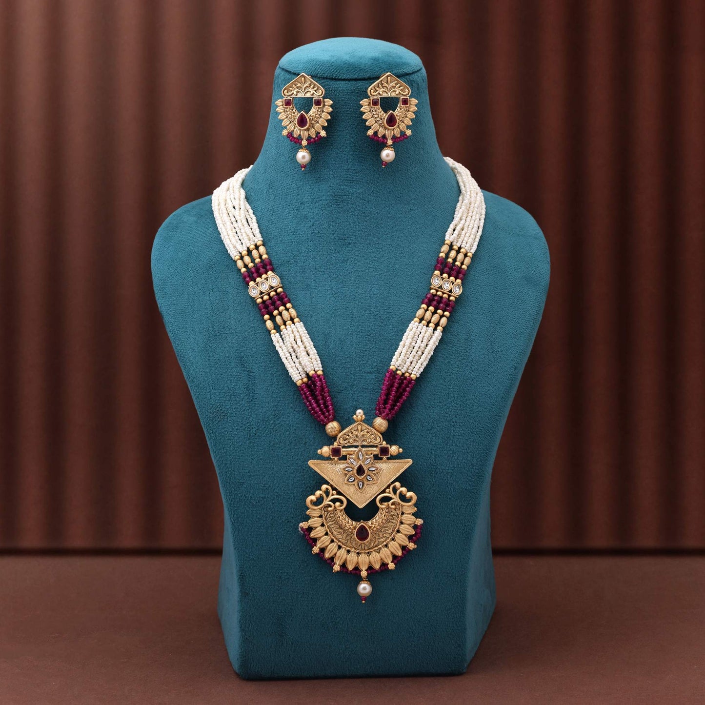 Gorgeous Rani Color Matte Gold Necklace Set With Premium Stone Embellished Temple Motifs