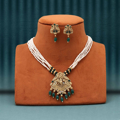 Captivating Green Color Matte Gold Necklace Set With Intricate Peacock Feather Inspired Design