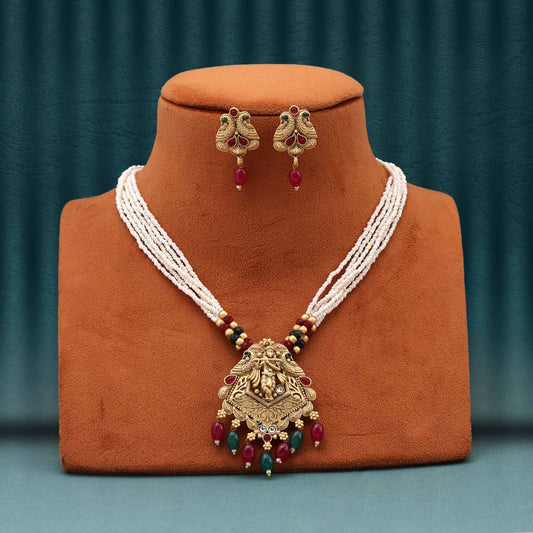 Luxurious Rani And Green Color Matte Gold Necklace Set Crafted With Polki Stone Accents