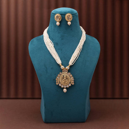 Classic Gold Color Matte Gold Necklace Set Adorned With Traditional Temple Inspired Craft