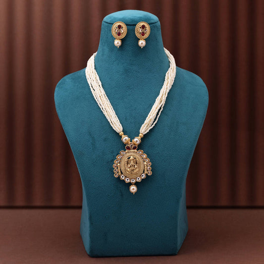 Lovely Rani Color Matte Gold Necklace Set Designed With Intricate Handcrafted Ethnic Patterns