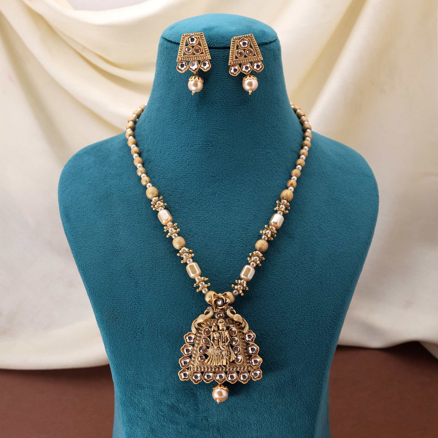 Grand Gold Color Matte Gold Necklace Set With Antique Look And Fine Stone Detailing