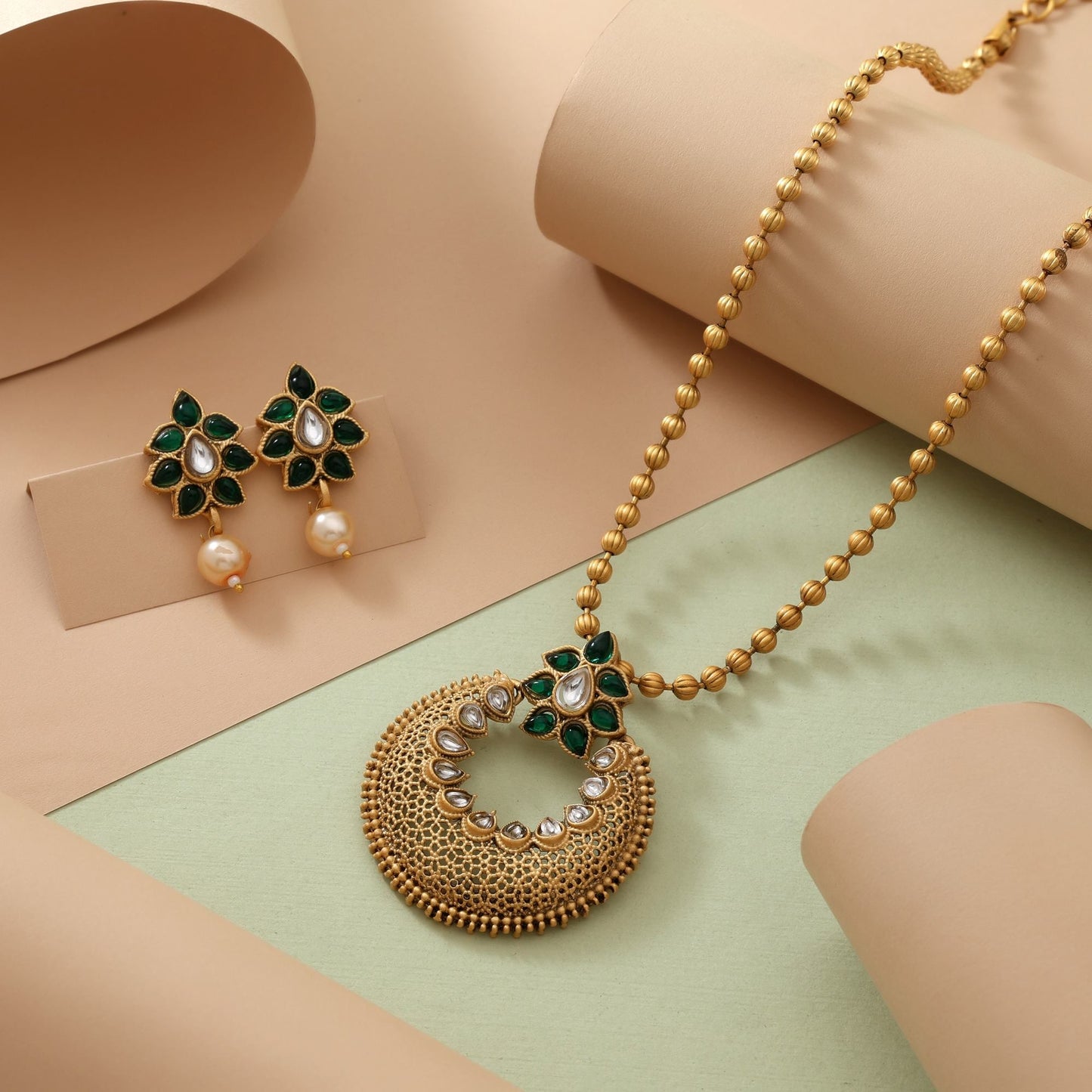 Gorgeous Green Color Matte Gold Necklace Set Crafted With Kundan Stones And Artistic Embellishments