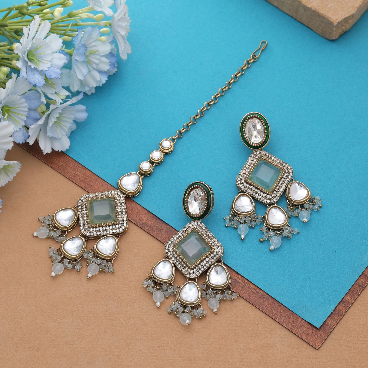 Charming Sky Blue Color Kundan Earrings Tikka Set For Elegant Festive Wear