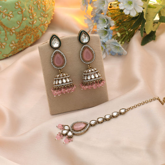 Charming Light Pink Color Kundan Earrings Tikka Set With Stylish Bridal Artwork