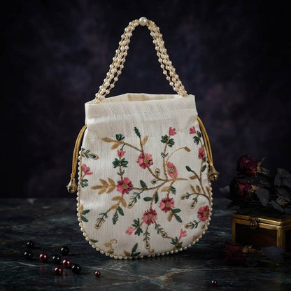Elegant Off White Color Pearls Handwork Silk Potli Bag For Weddings