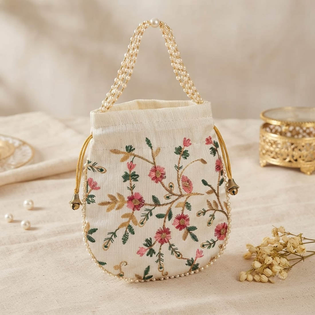 Elegant Off White Color Pearls Handwork Silk Potli Bag For Weddings