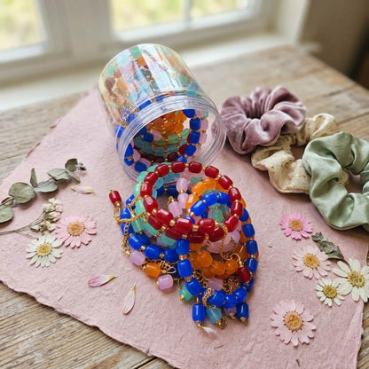 Multi Color Set of 12 Bracelet Rakhis Featuring Trendy Ethnic Handmade Style