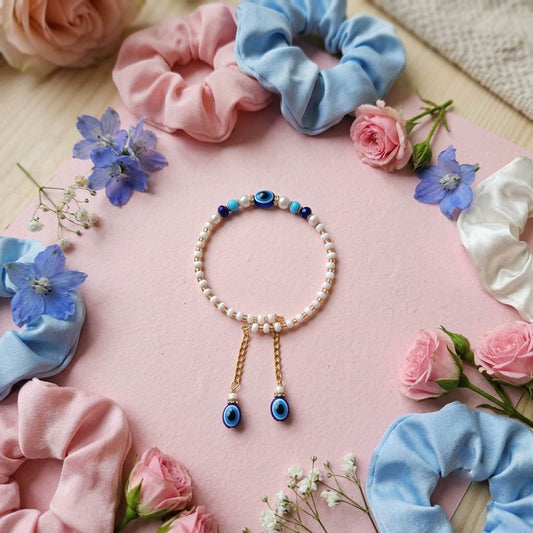 Blue & White Color Set of 12 Bracelet Rakhis with Elegant Traditional Design